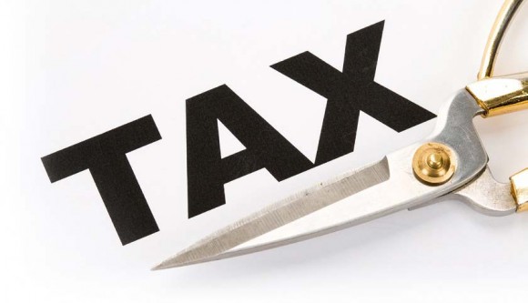 Photo of scissors under the word Tax