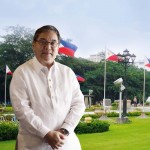 Photo of Ramon Jimenez in front of Rizal Park Monument