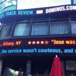 Dominos twitter feed consumer responses on displayed on digital ticker on building